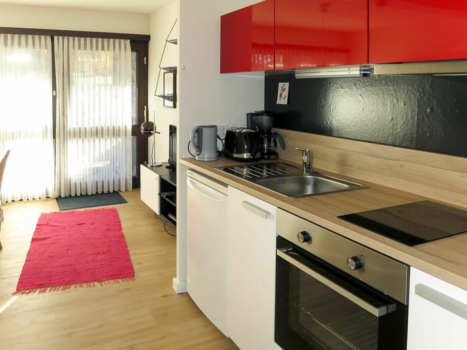 Countertop, Property, Room, Kitchen, Furniture, Cabinetry, Interior Design, Red, Building, House