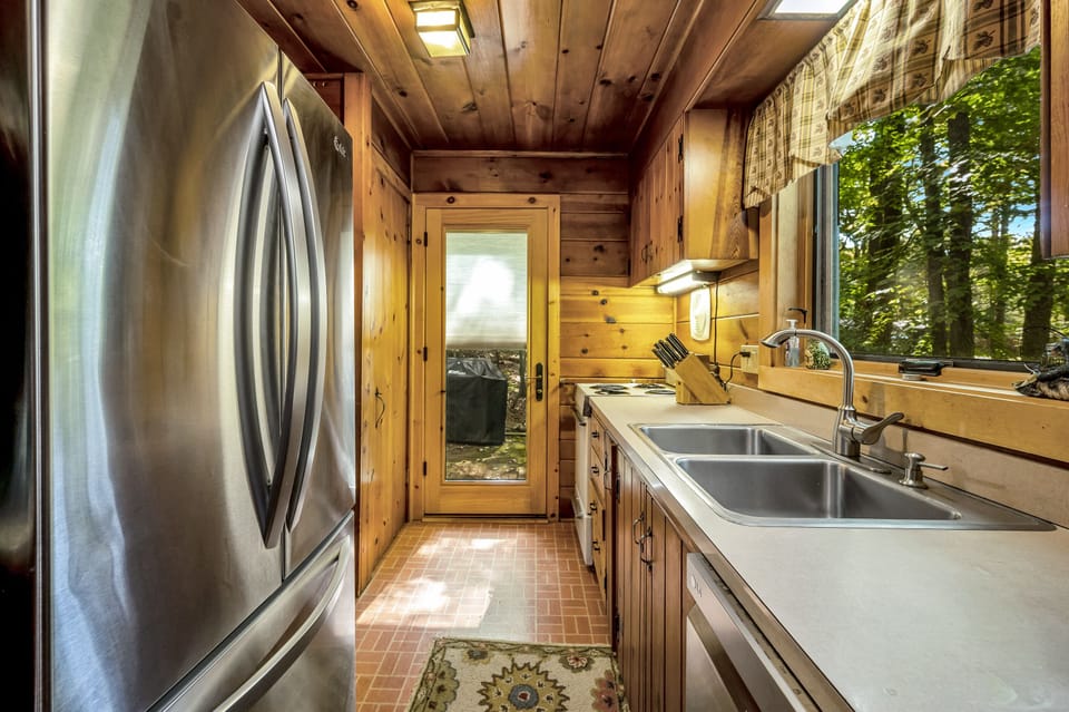 Kitchen. Door leads to outside deck