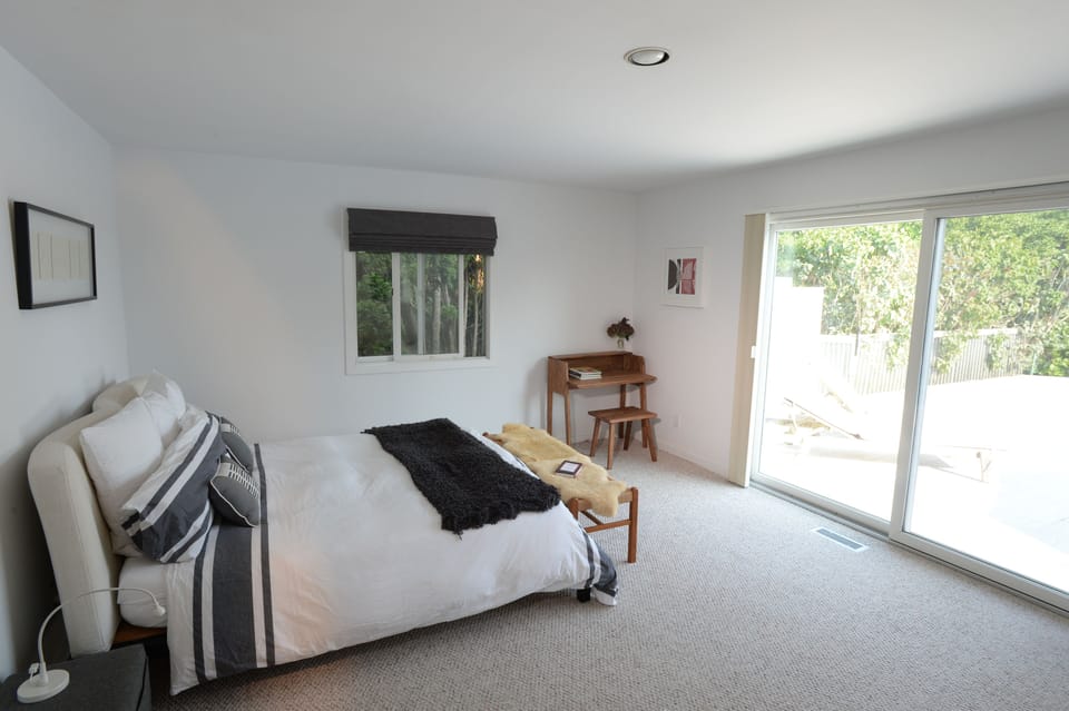 Guestroom 1 with view to deck and pool