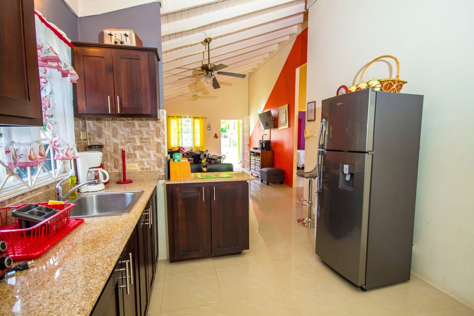 Fully equipped kitchen with stove and microwave