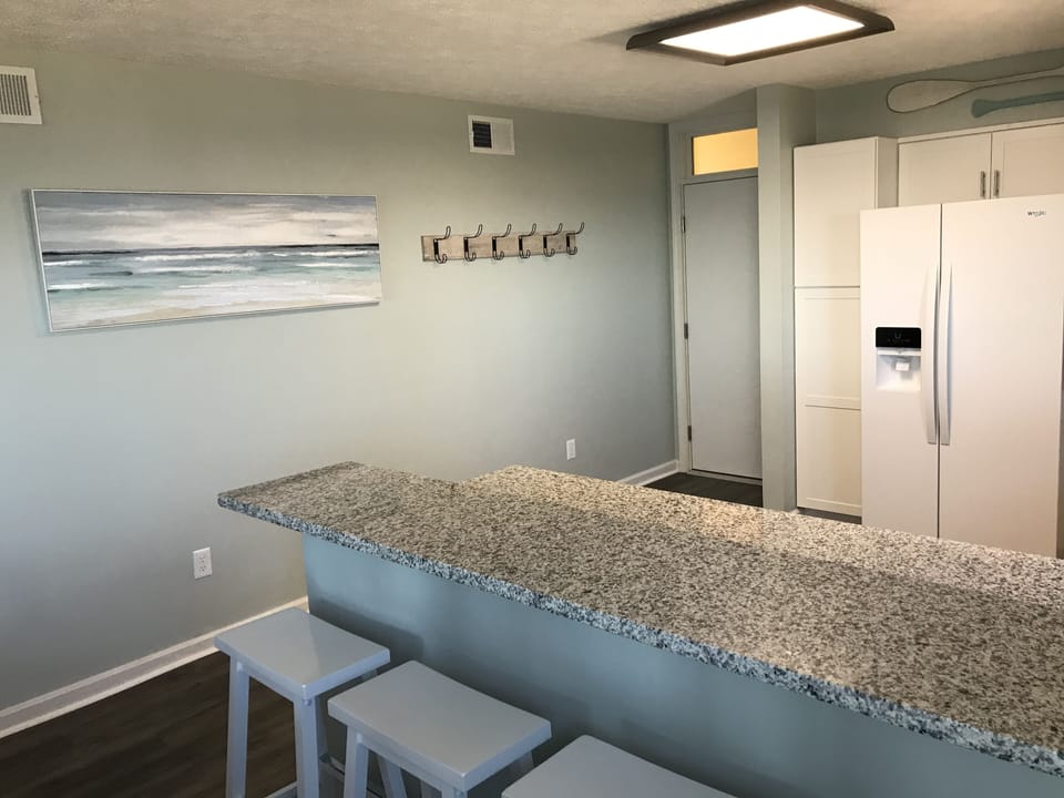 Entry way with multiple hooks to hang beach towels to dry. 