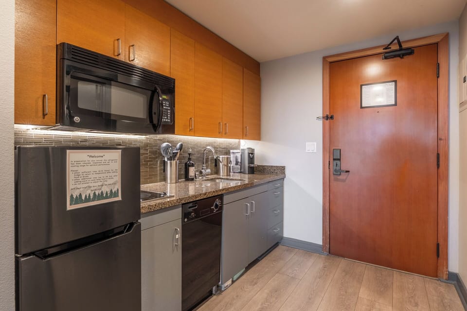 The galley kitchen sits just inside the entry, making it easy to drop groceries and settle in the moment you arrive.