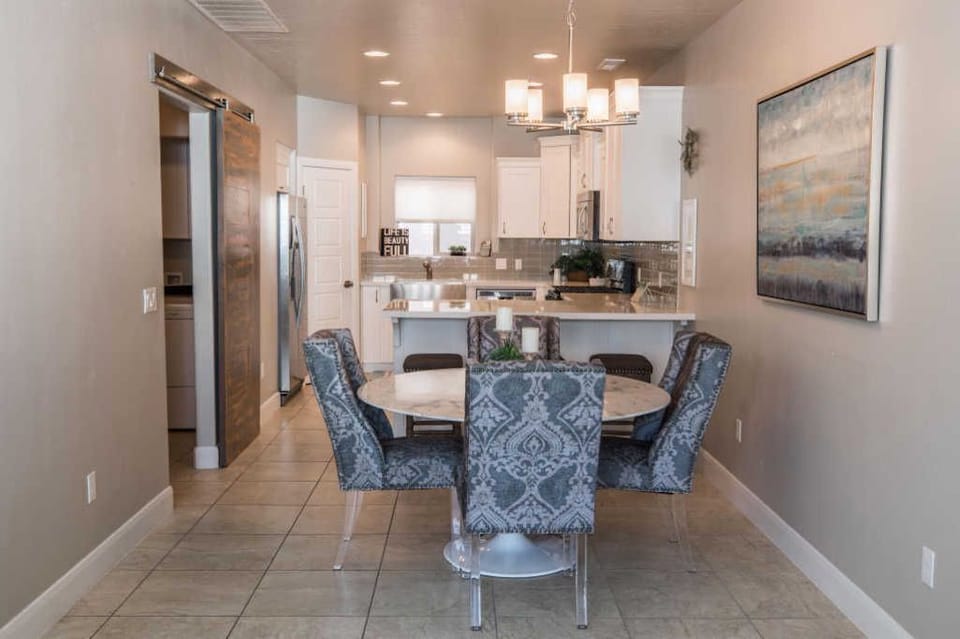 Dining area, kitchen, door to garage entry to left
