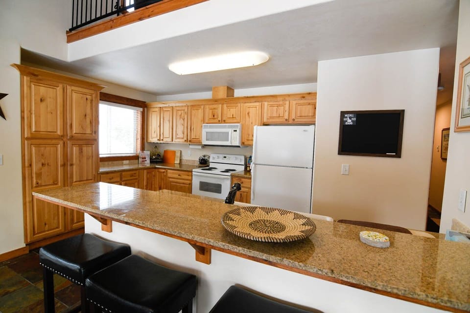 Open Kitchen stocked with basics.  Guests can join at the bar.