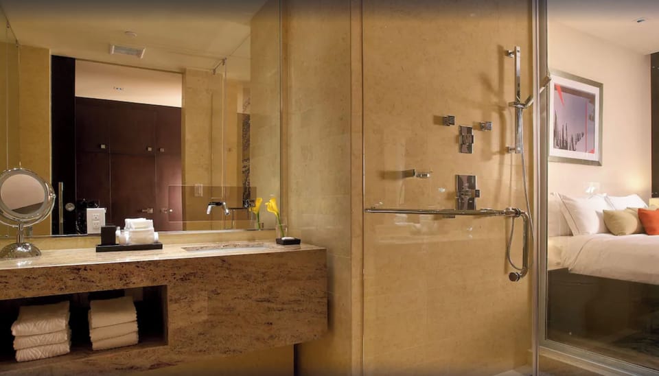 Refresh in a glass-walled shower with spa-like finishes.
