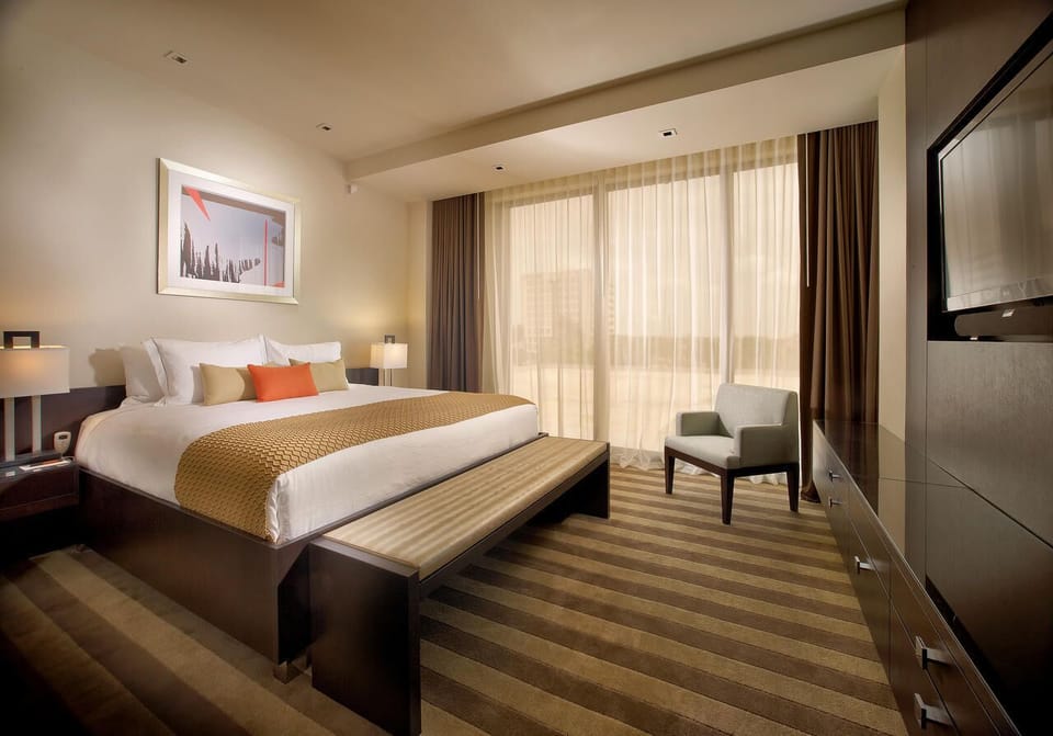 Unit with 1 King bed. Exact unit will be assigned upon arrival. Views, colors, and decor may vary.