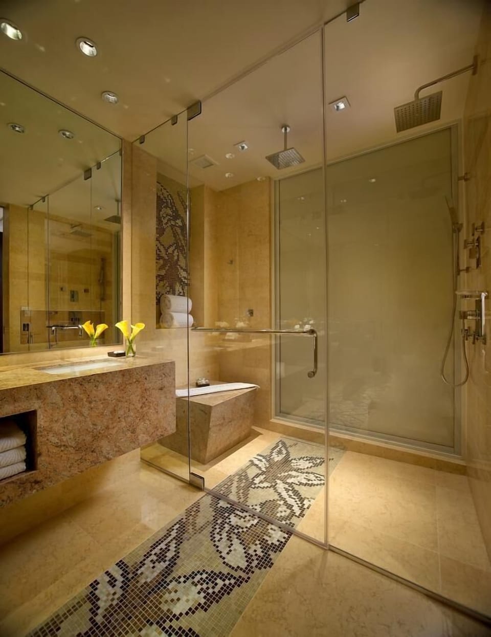 Indulge in a luxurious bath with gleaming stone surrounds.