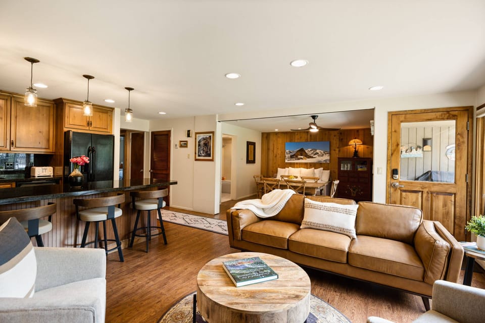 The open concept living space is a warm and welcoming area for friends or family traveling together to enjoy each others company.