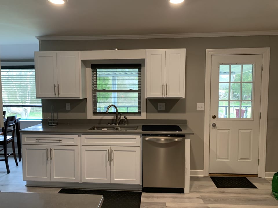 New counter tops and sink in kitchen 