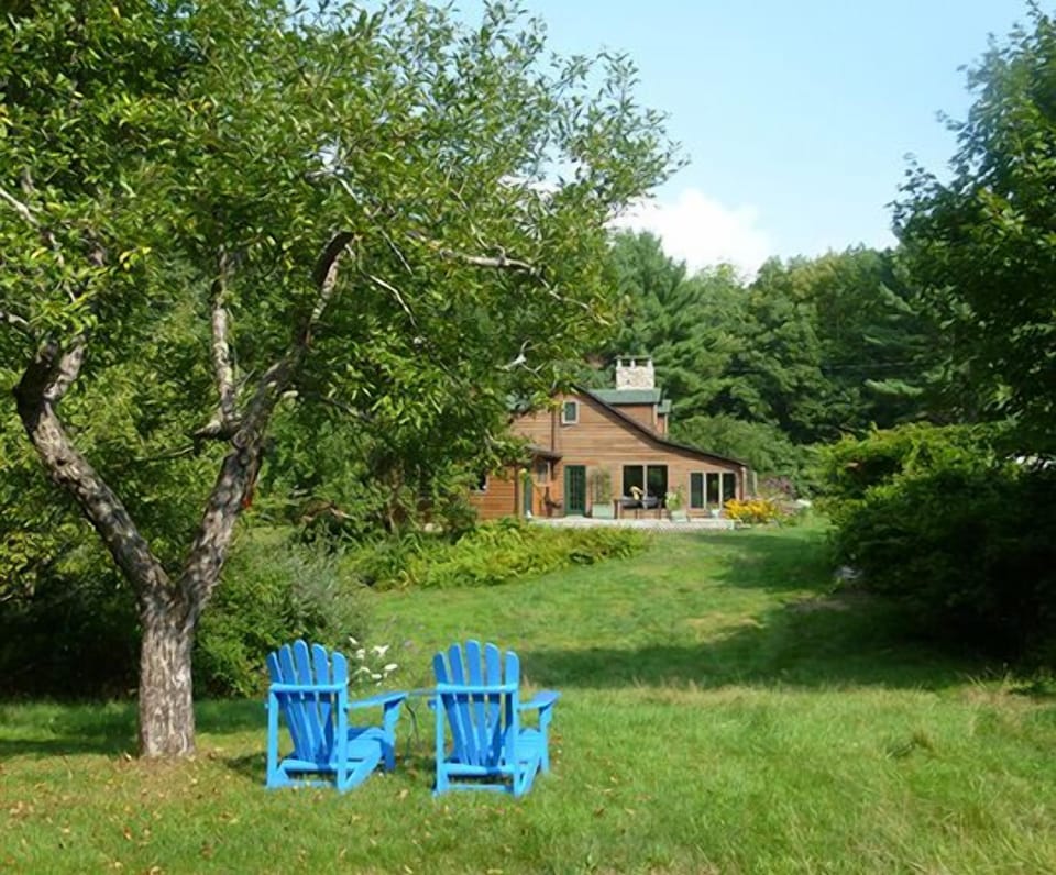 Sit under one of the apple trees overlooking the meadows and forest.