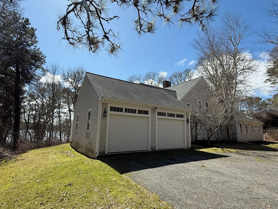 House Front with Pond Behind