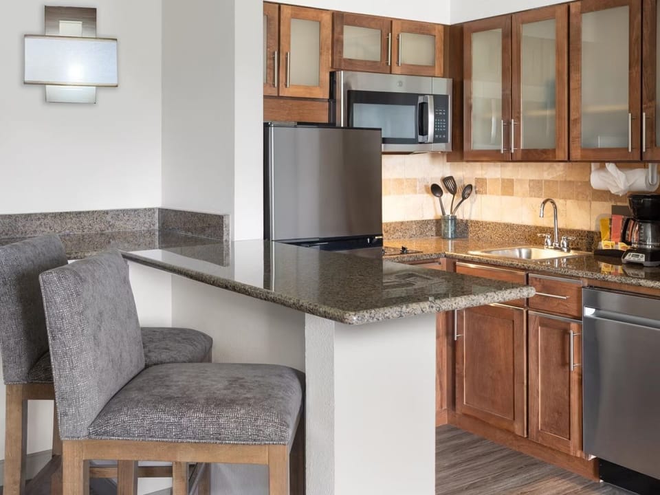 Fully equipped kitchen with stove, microwave, dishwasher, and coffee maker — everything you need to cook for the group