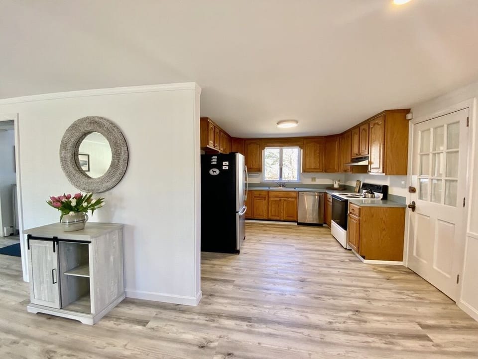 View 2: Kitchen & door to laundry,  mudroom, half bath & house side door