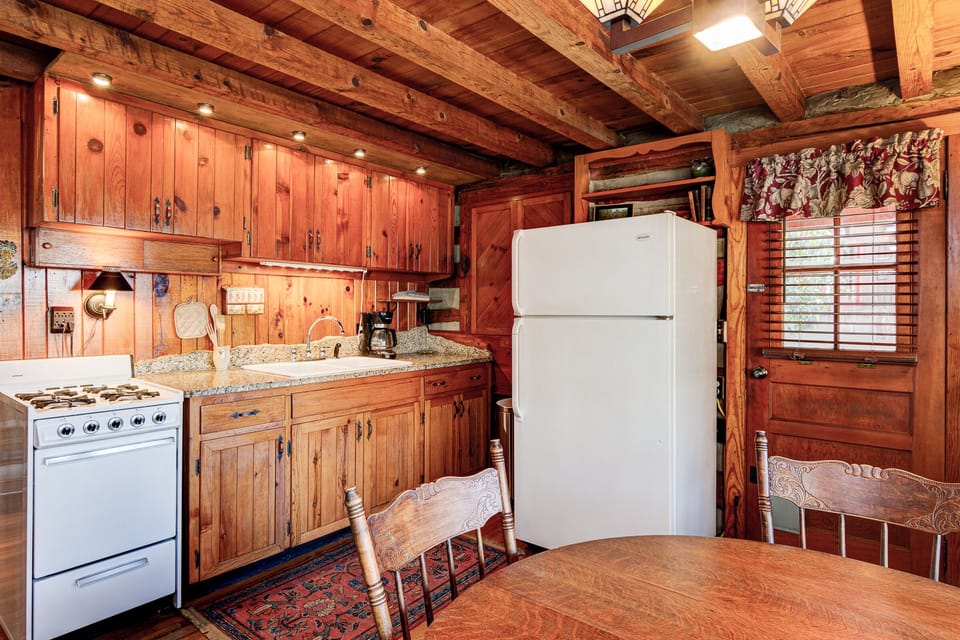 Fully equipped kitchen with recessed LED lighting.