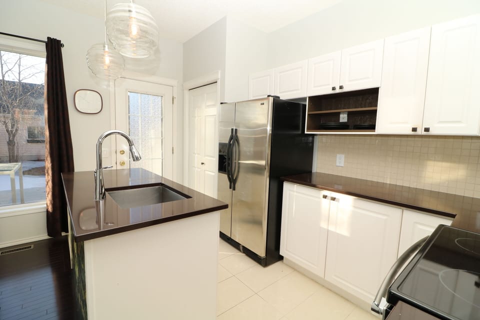 Kitchen features SS Appliances and is steps away from the BBQ on the rear deck