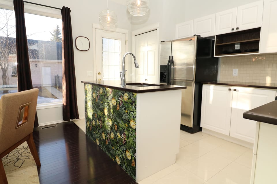 Kitchen features SS Appliances and is steps away from the BBQ on the rear deck