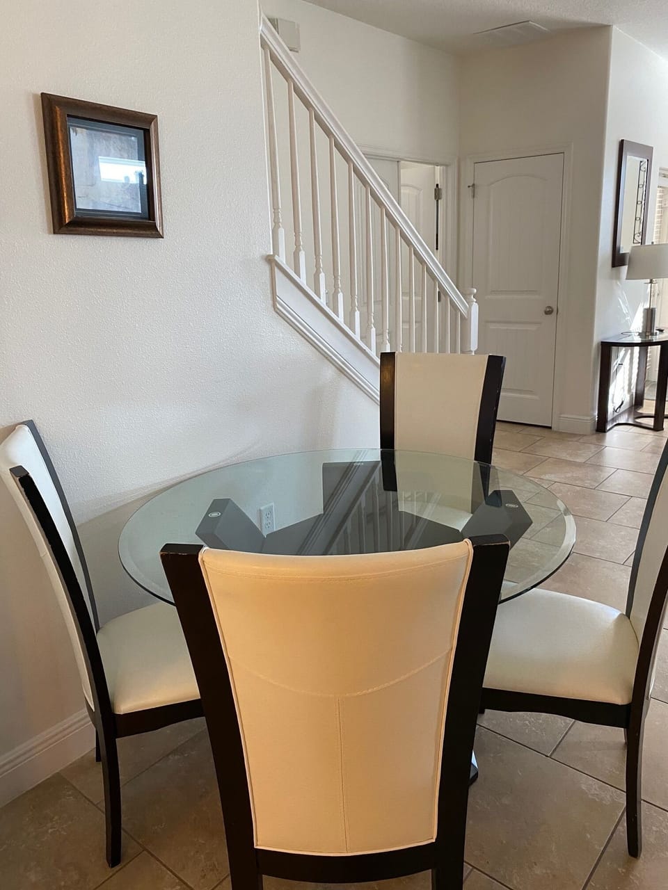 4 top glass table off of the kitchen