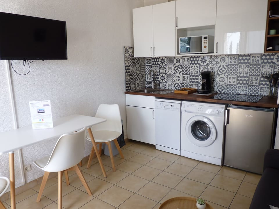 New fully equipped kitchen for this new season : Dishwasher, Washing Machine, Fridge top, Microwave