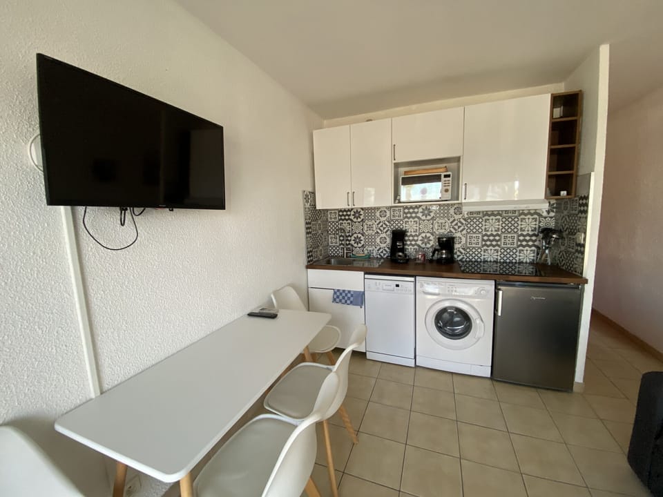 Kitchen area with all amenities as well as dining area