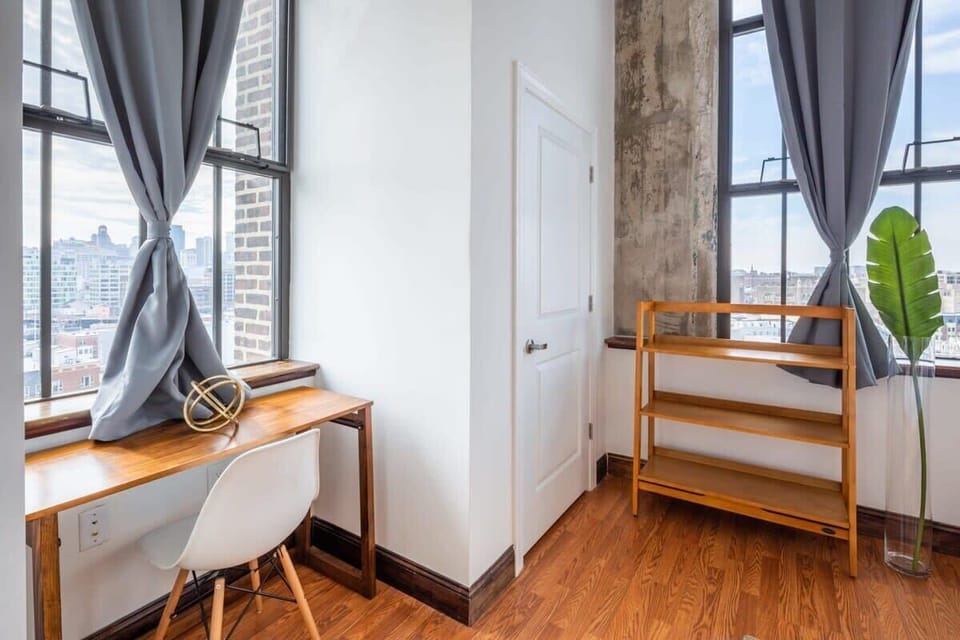 This work area is in the master bedroom, located by a beautiful window