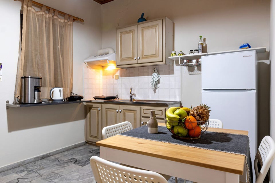 Kitchen and Living Area with Warm Lighting – Cozy combined space blending practicality and charm.