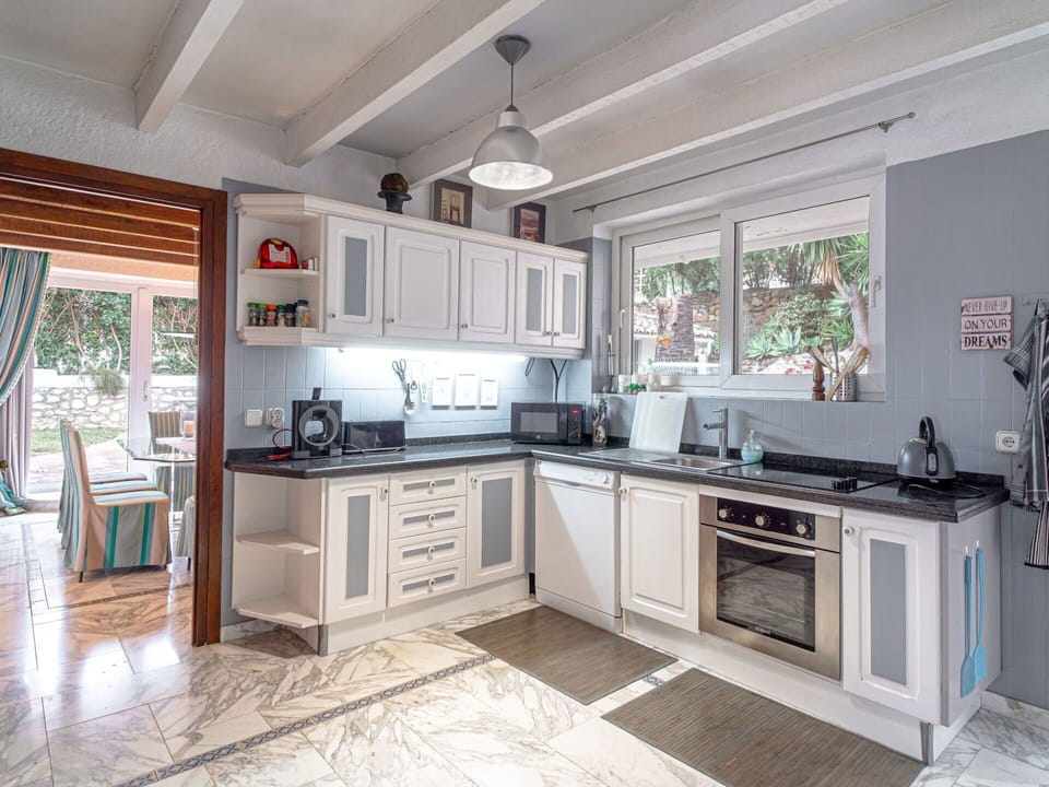 Cabinetry, Countertop, Property, Sink, Kitchen Stove, Kitchen Appliance, Home Appliance, Kitchen Sink, Kitchen, Wood