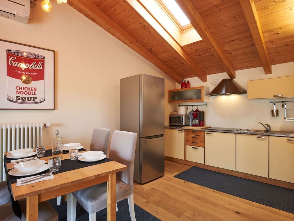 Property, Furniture, Cabinetry, Table, Wood, Interior Design, Countertop, Exhaust Hood, Tableware, Kitchen