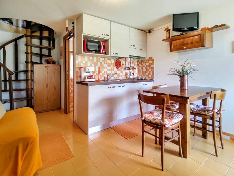 Furniture, Property, Table, Wood, Lighting, Television, Orange, Interior Design, Flooring, Floor