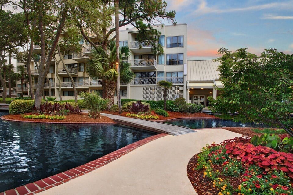Beautiful manicured gardens with fish ponds and exotic flowers