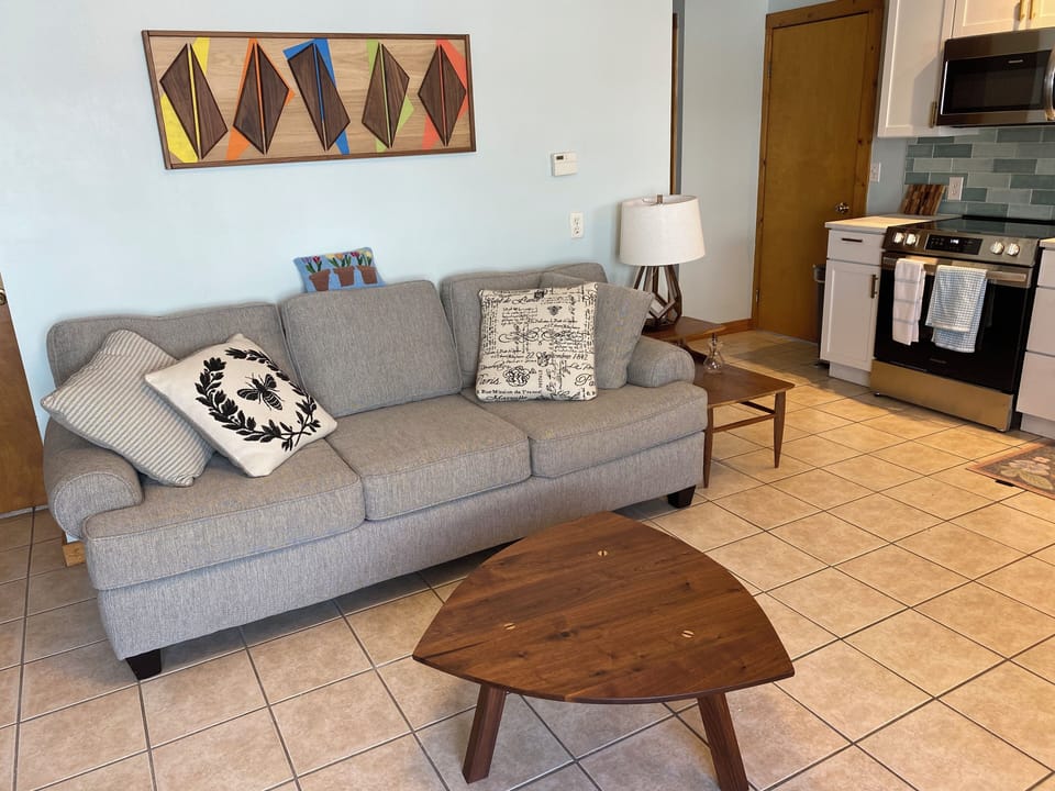 Living room. Mid century wooden furniture and art work.