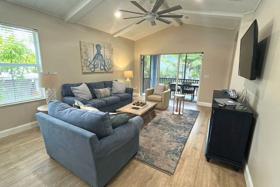 Living Room to Screened Lanai and Private Pool Area