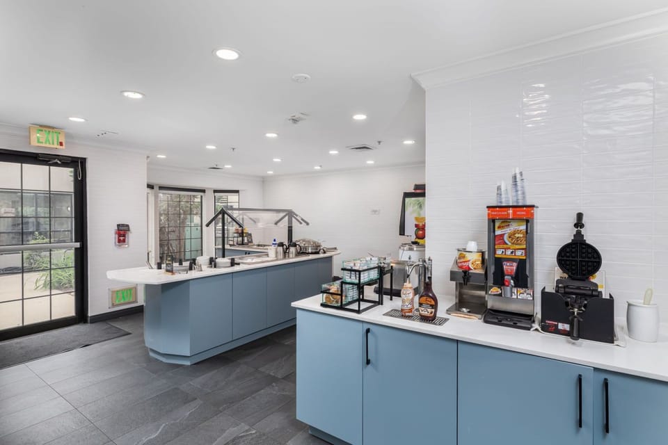 Breakfast station with cereals, pastries, and fresh beverages to start your day