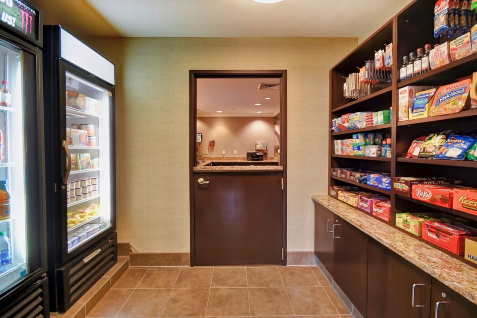 On-site pantry stocked with snacks and essentials for extended-stay guests