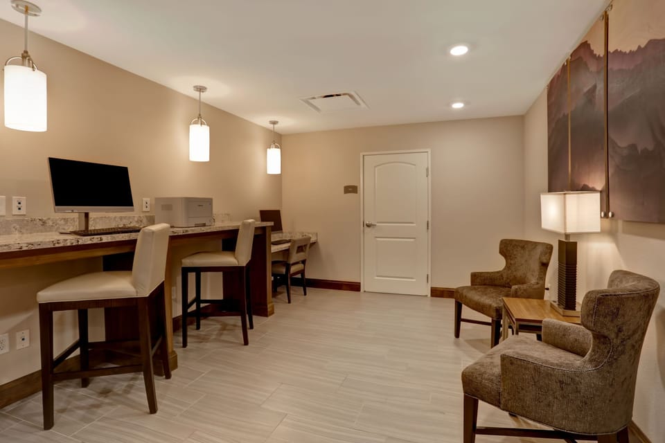Bright business work area with desks and modern lighting.