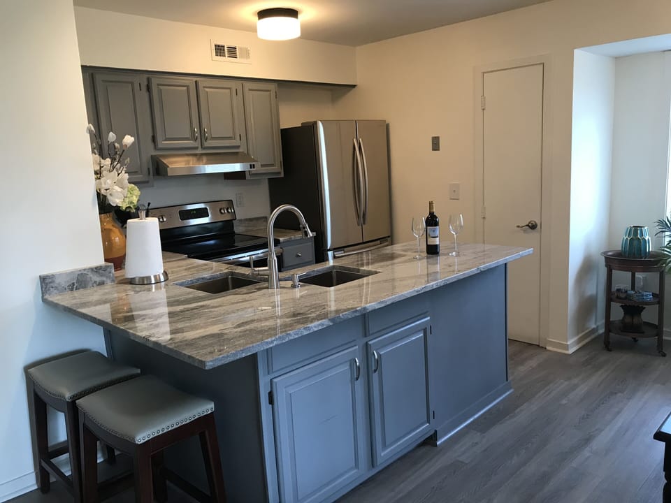 Large kitchen and bar, fully stocked with everything you need for cooking.