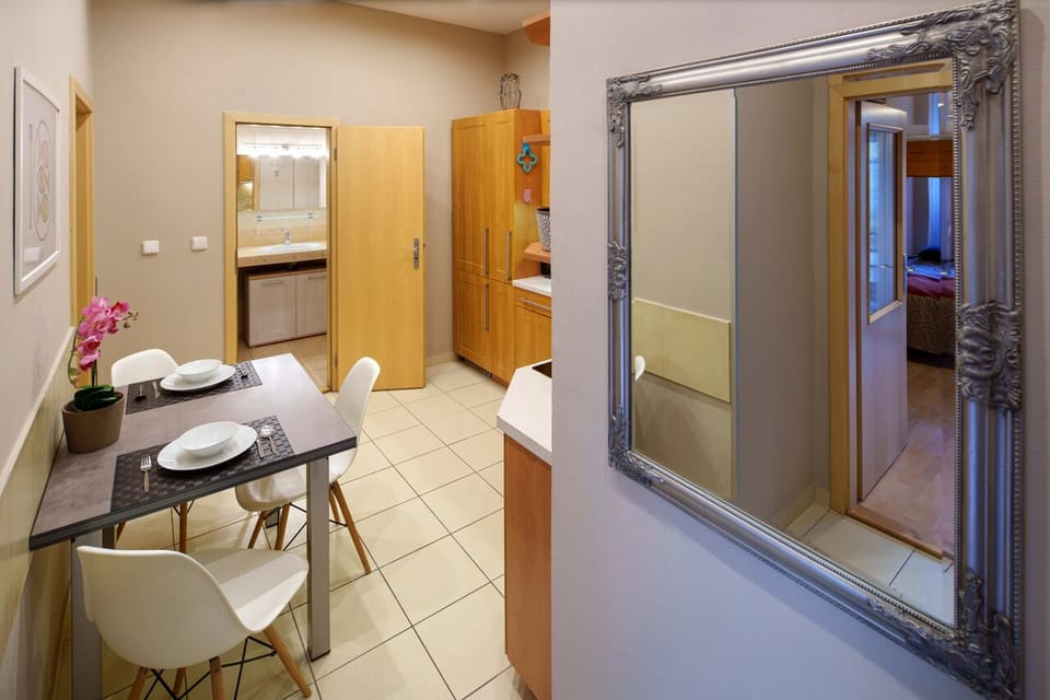Entry with kitchen with dining table
