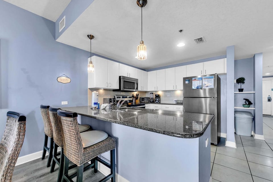 Eat-in kitchen bar has seating for three