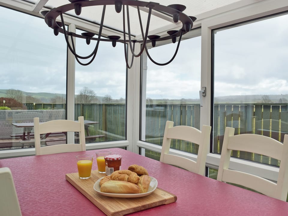 Conservatory with patio door leading to garden | Pleasant Valley, St Florence