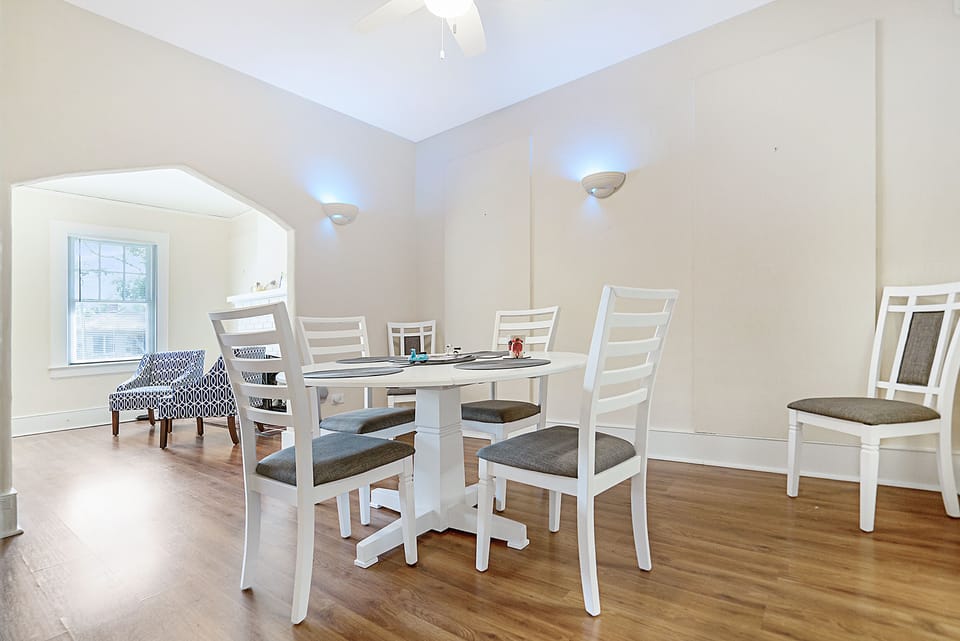 Dining room with smart speakers, smart lights, and fun, random archway.