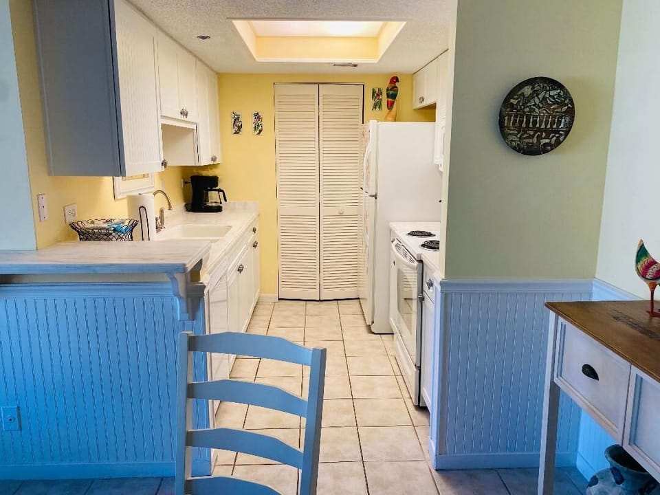 Kitchen with all you need to prepare and serve meals...Washer/dryer closet.