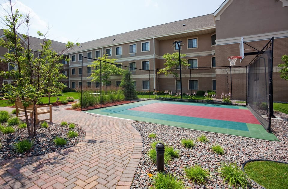 Shoot some hoops or enjoy a leisurely stroll along the vibrant outdoor court.