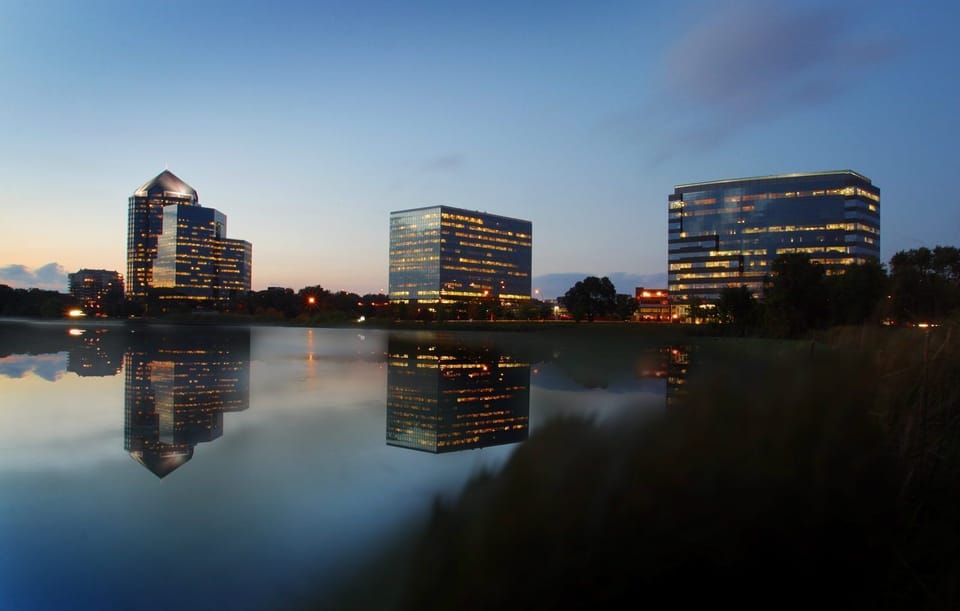 Minneapolis skyline reflected on the water — the city is just a short drive from the hotel