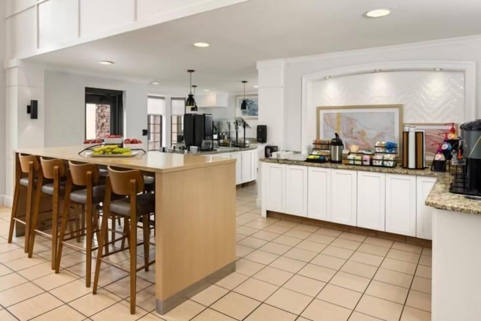 Hot and cold options laid out every morning — the complimentary breakfast buffet has you covered