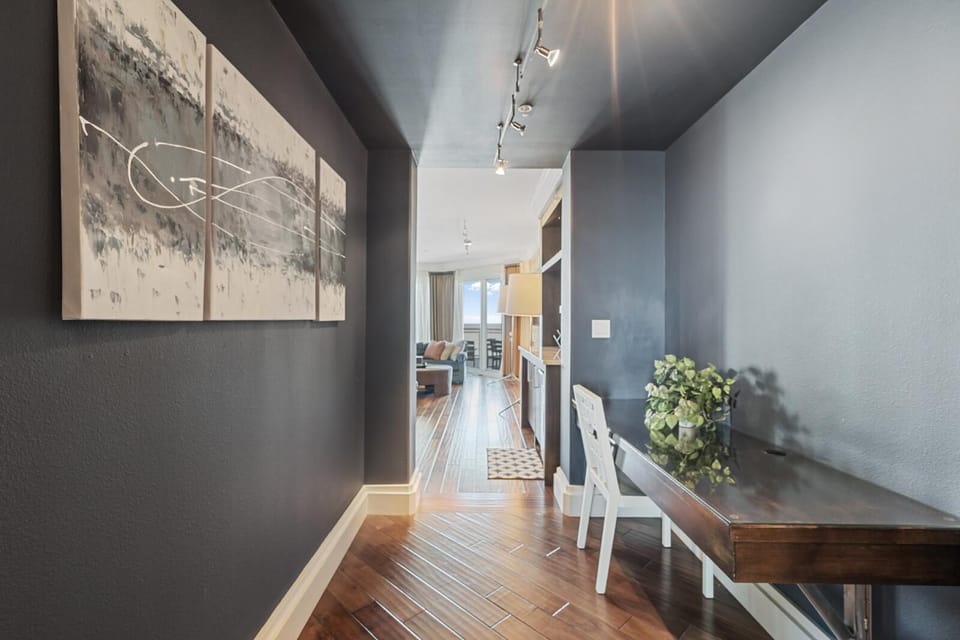 Chic hallway with elegant wood flooring and natural light