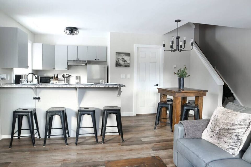 Each side of the condo has a full modern kitchen with stainless steel appliances