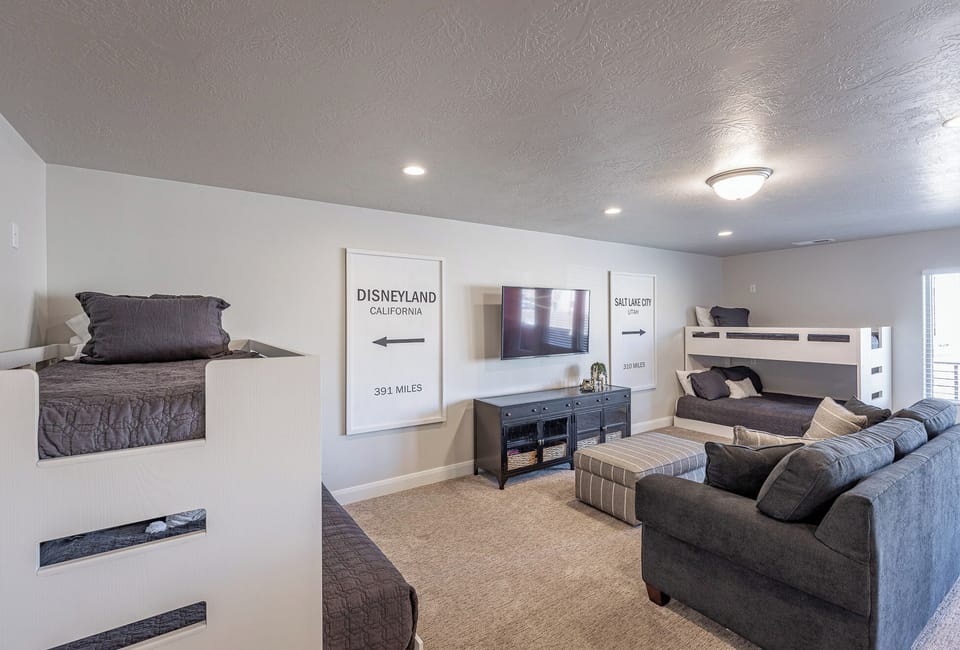 Upstairs Loft and Built-In Bunkbeds - This upstairs loft area has two twin over full bunk beds and a Queen sleeper sofa.