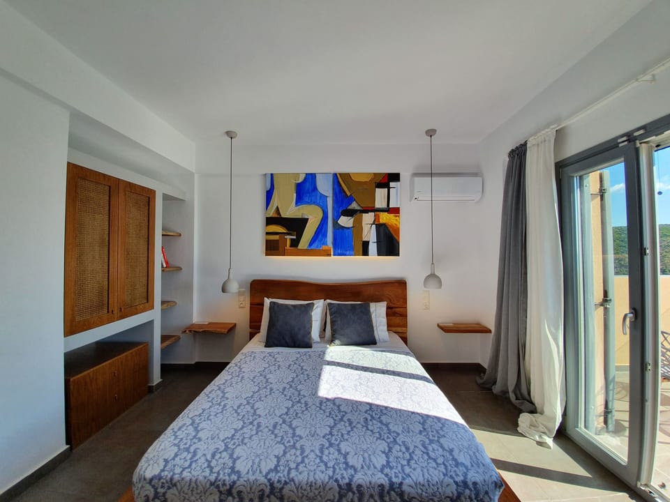 Spacious bedroom with luxurious furniture and works of art