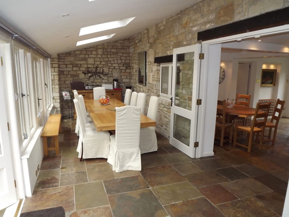 The Conservatory Dining Room seats 16 (with extension). Under floor heating.