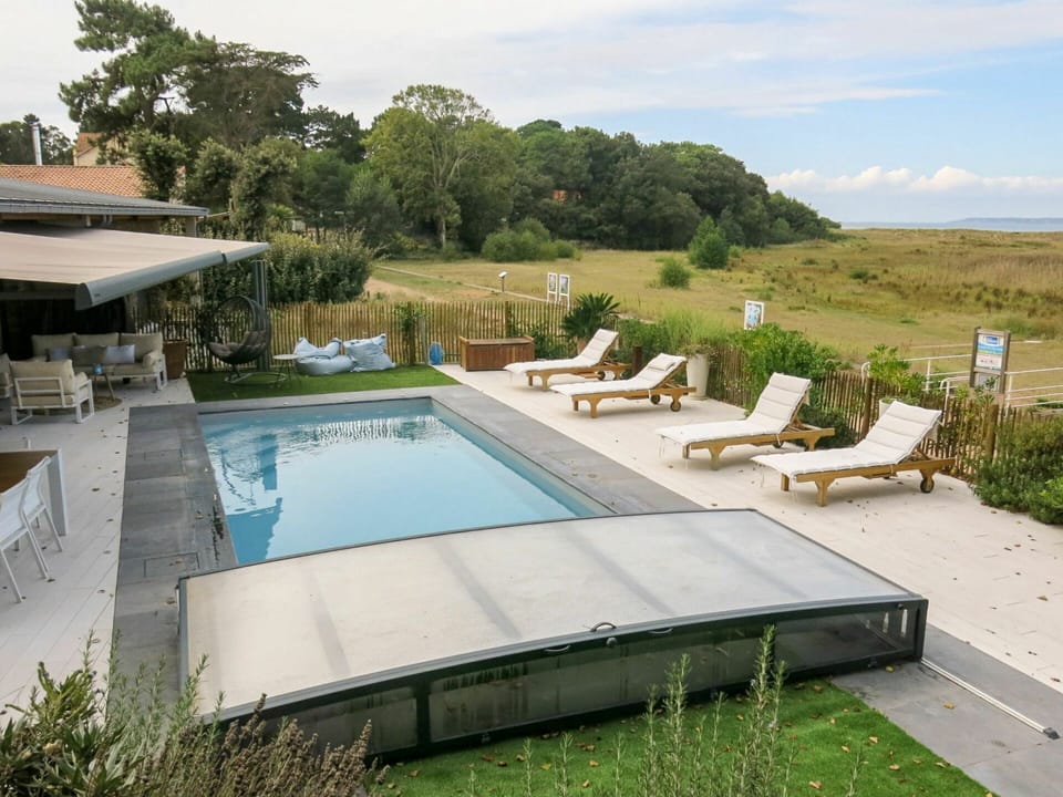 Water, Plant, Cloud, Property, Sky, Swimming Pool, Outdoor Furniture, Shade, Sunlounger, Tree