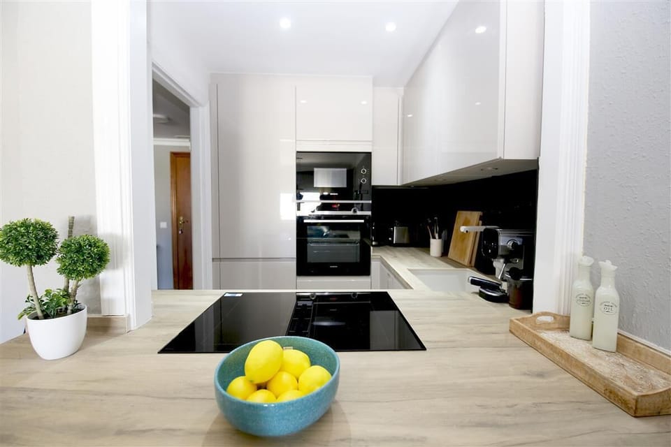 Another view of the kitchen from the dining bar